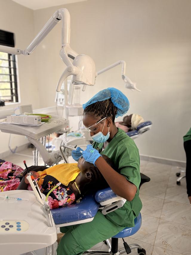 A Ugandan clinician at work in the dental surgery